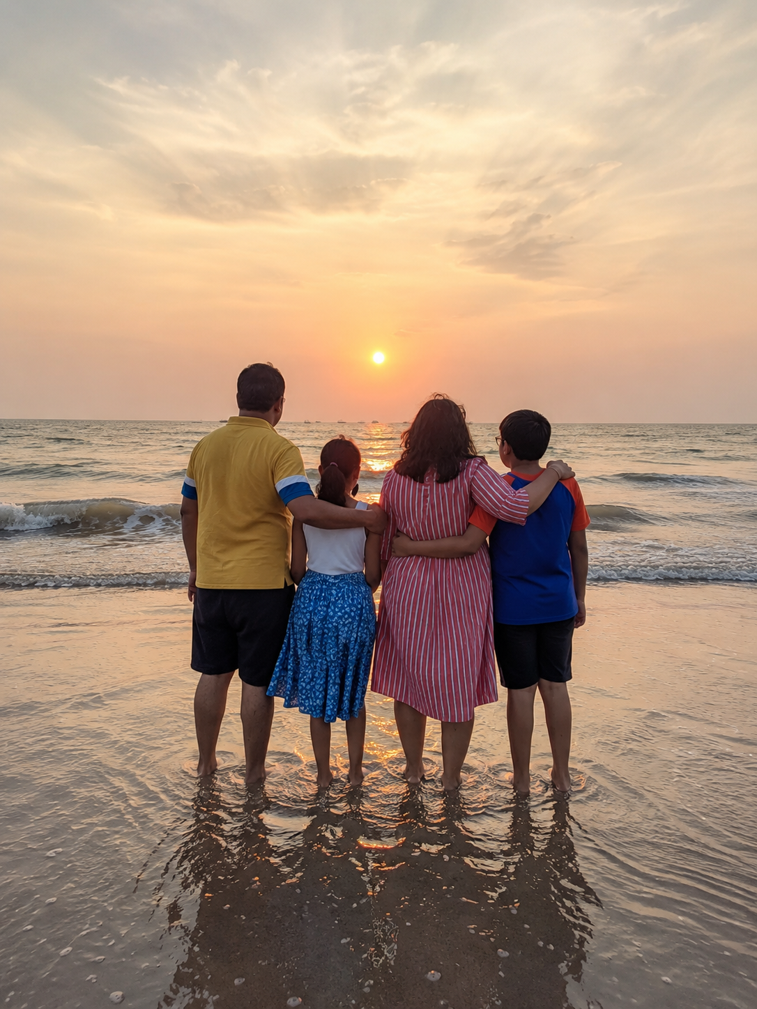 Ekta with her family watching a sunset by the sea — the heart of her work